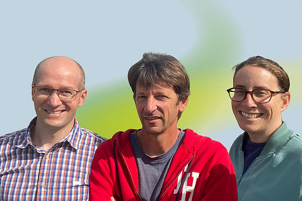 Zwei Männer und eine Frau.